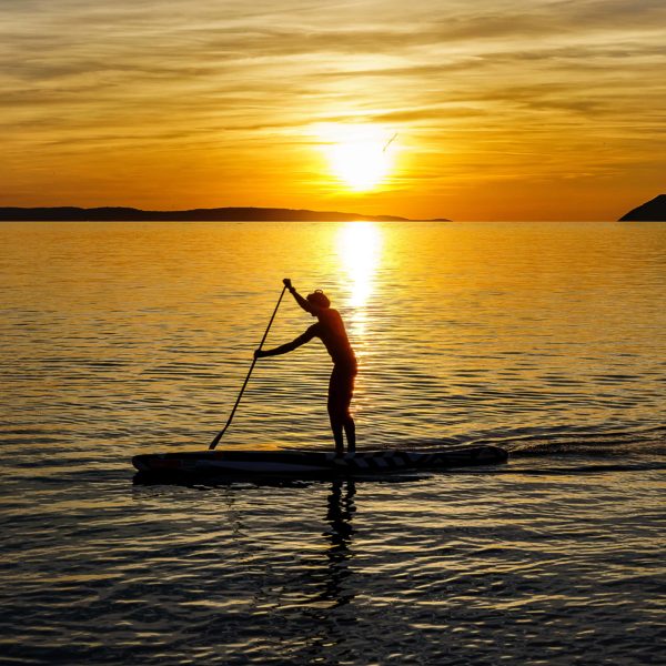 Paddle surf on sunset in Barcelona
